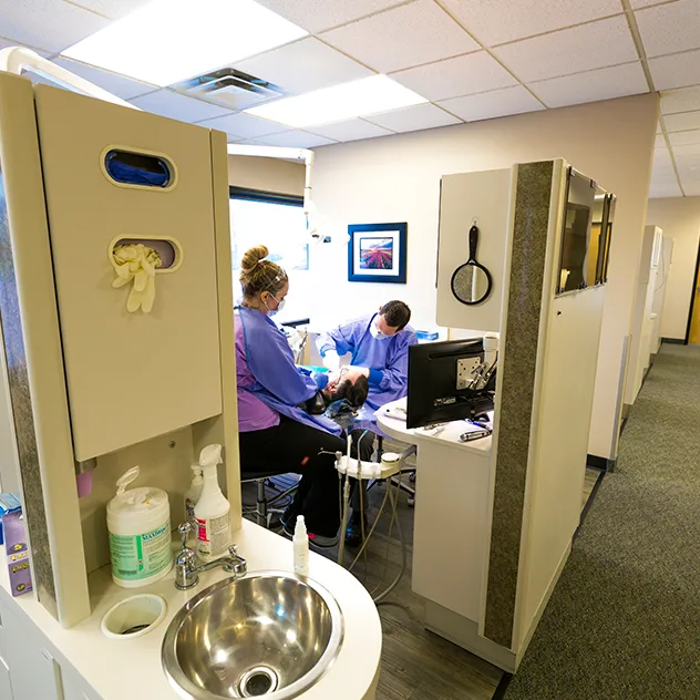 27975 dentist examining teeth